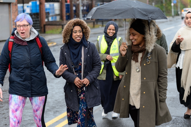 A group of women walking outside.