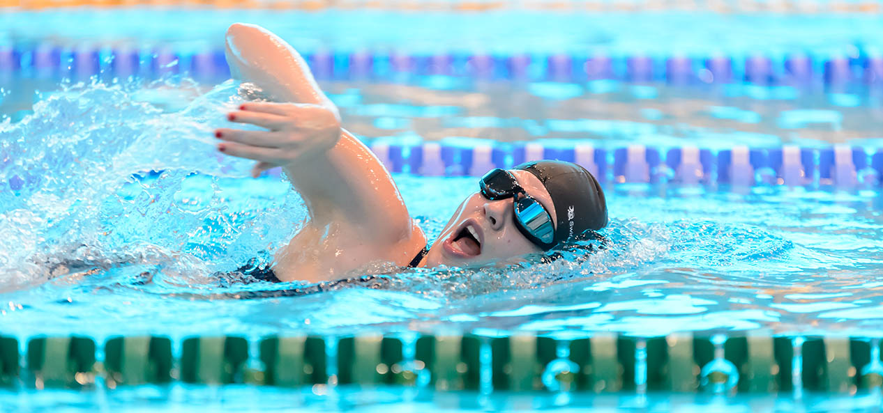 A woman swimming in a pool