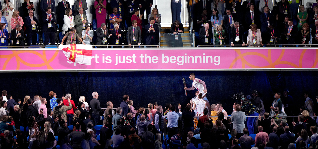 'Sport is just the beginning' is displayed on a board at the opening ceremony of the Birmingham 2022 Commonwealth Games as Max Whitlock delivers the Queen's Baton into the Alexander Stadium