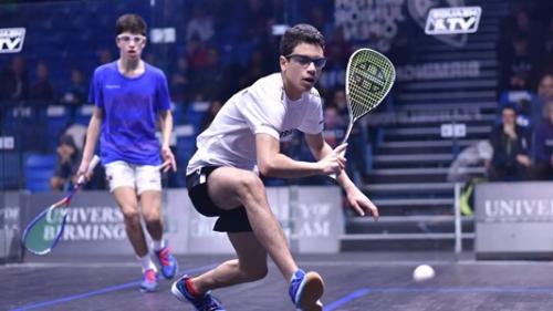 boy playing squash