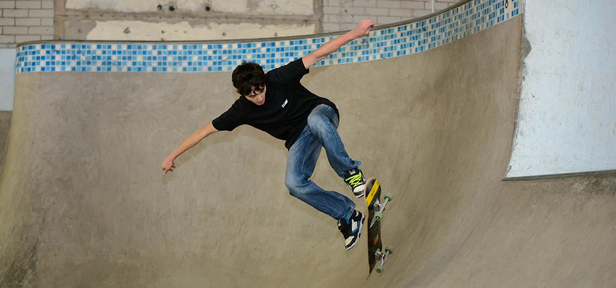 A young man enjoying the skate park