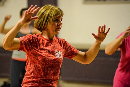 A woman exercising in a class.