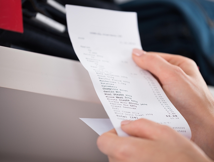 A person holding a receipt