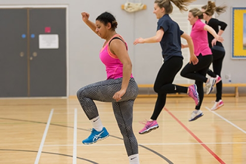 People jumping in an exercise studio