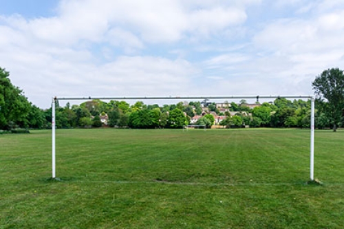 A sports playing field showing a football goal