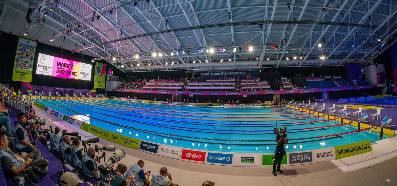 A fish-eye lens view of a crowd and swimming pool at the Sandwell Aquatics Centre during the 2022 Commonwealth Games in Birmingham.