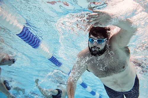 A man swimming in a pool