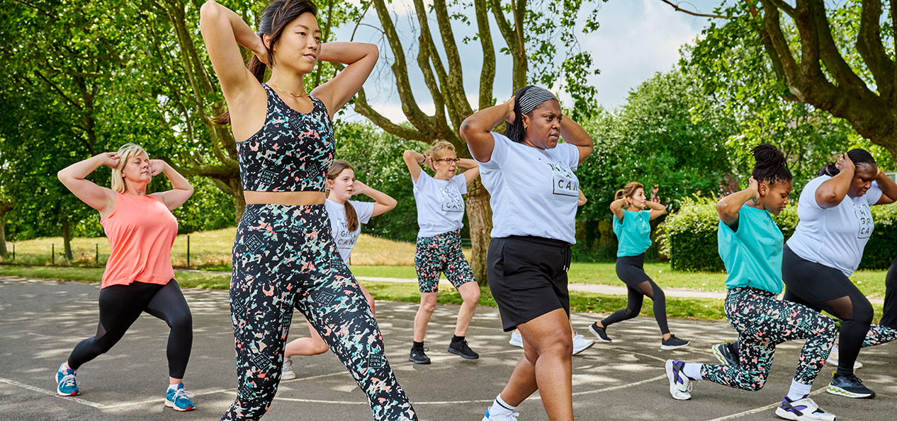 A group of women exercise outdoors wearing the This Girl Can range for Tesco