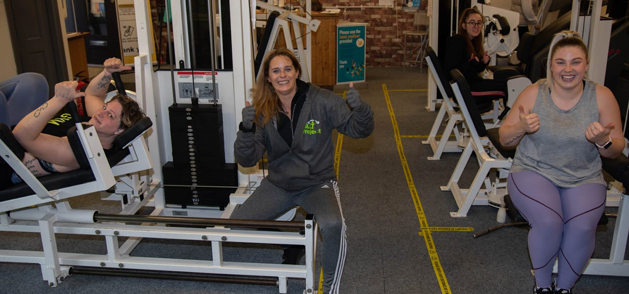 Members of The Billy Project pose for a photo in the gym