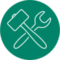 A pictogram in a green circle of a mallet and a spanner