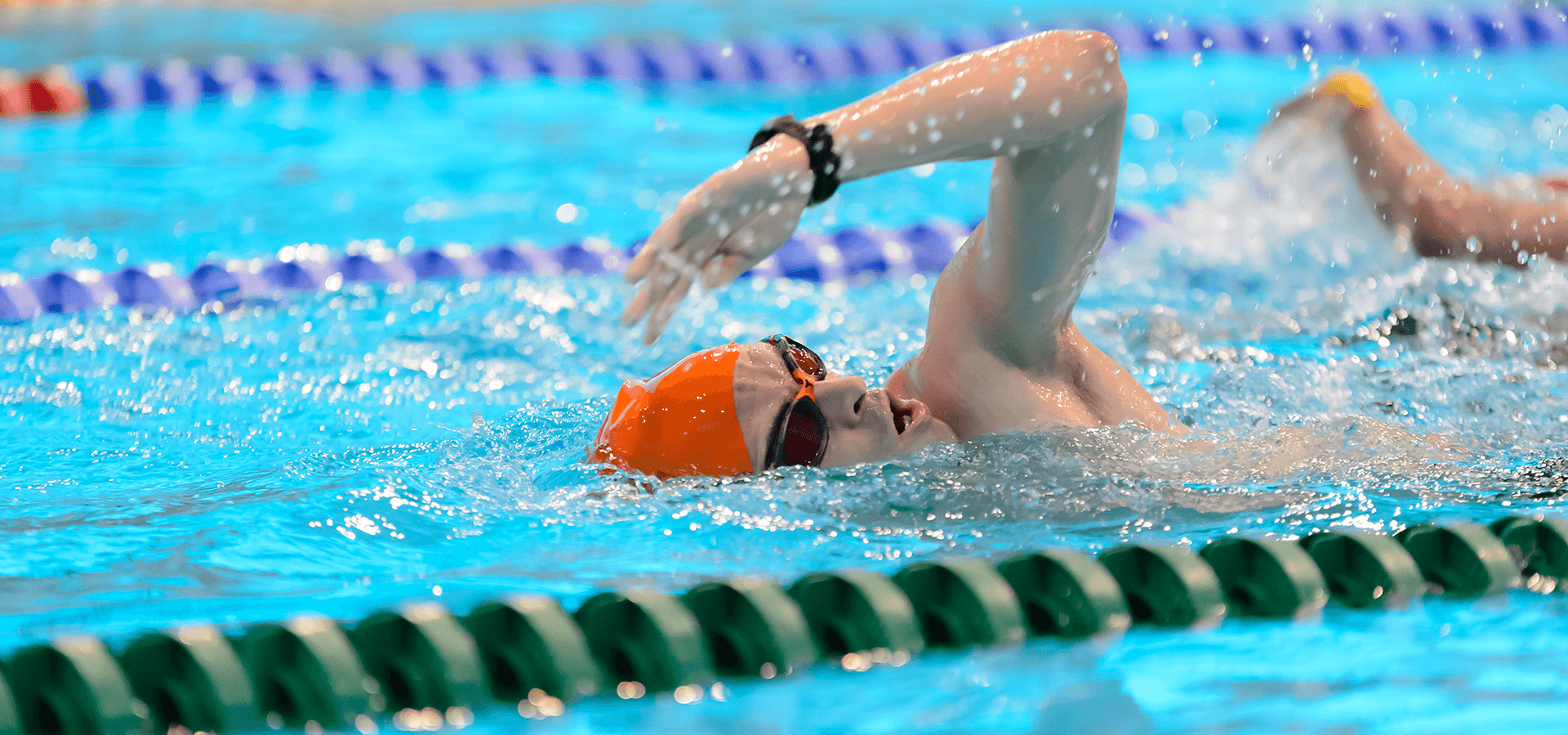 Man swimming in London Aquatics Centre