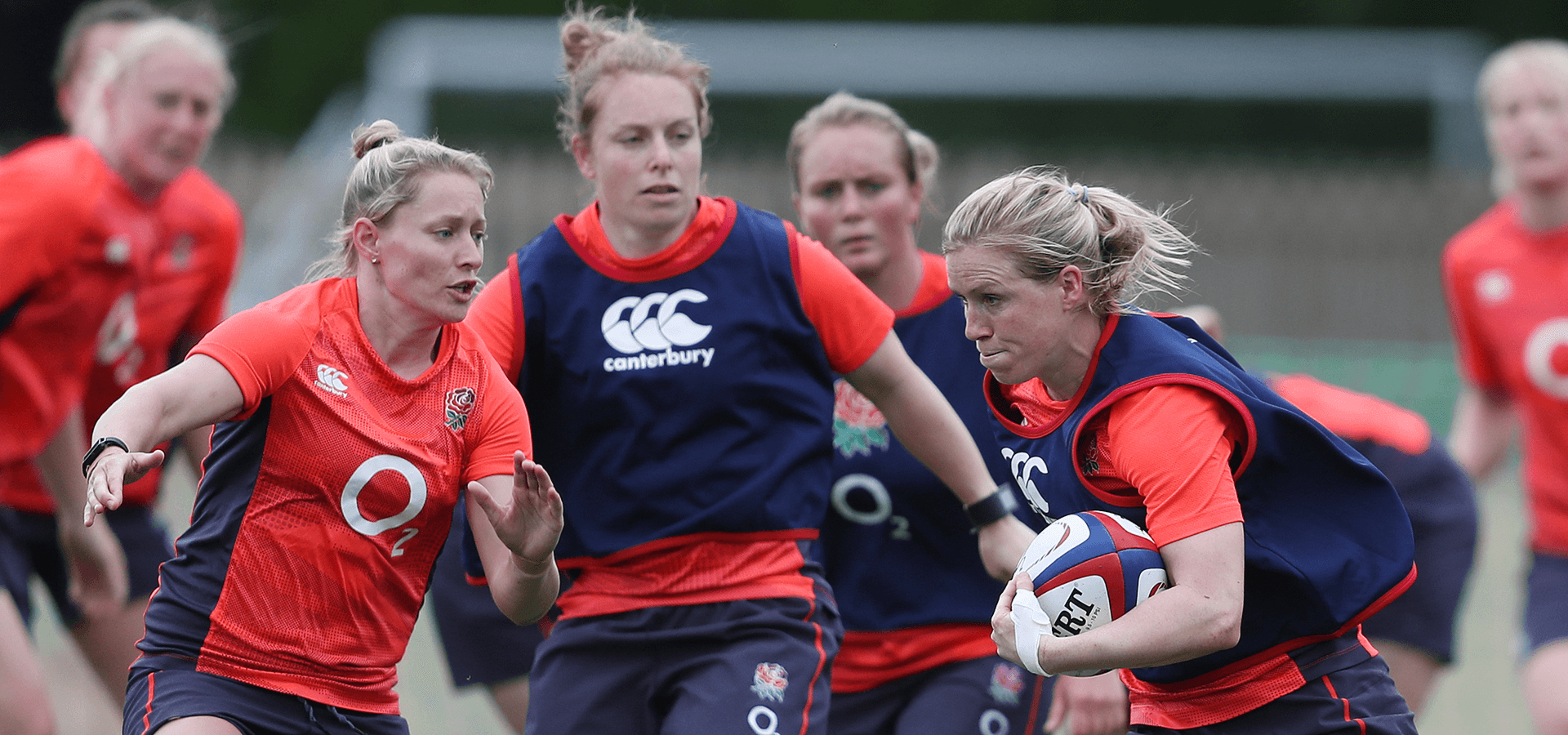 Women playing rugby outdoors 2